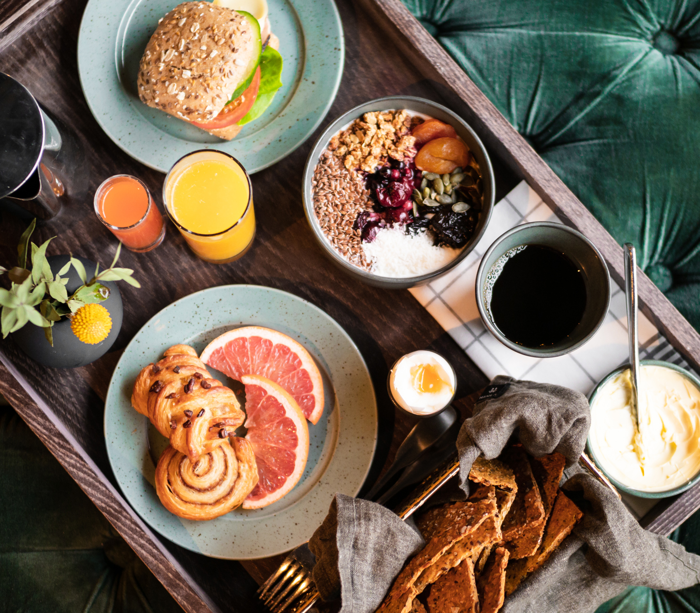 Breakfast tray laid out against a green background